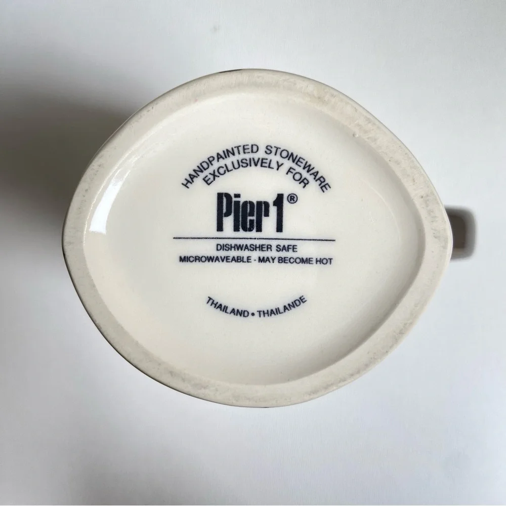 Pier 1 tall asymmetrical oval coffee mug with abstract fall leaves and stripes
